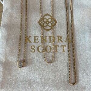 Kendra Scott gold triple layering chains.